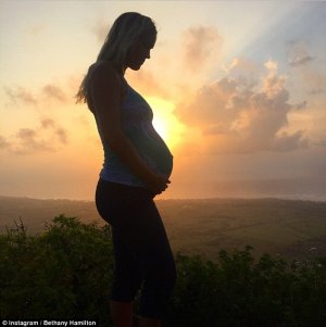 Athletic: Despite being in her third trimester, Bethany is eager to continue to live an active life. Last month, she posted this photo of herself cradling her bump atop a hill, with the sun shining behind her, on Instagram