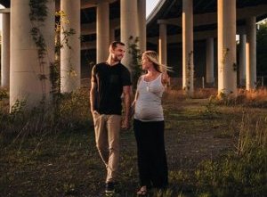 Couple: But despite her determination to spend time outdoors, Bethany (pictured with Adam) has admitted that she now finds it more difficult to walk up stairs - and says she has 'put the short board away for a while'